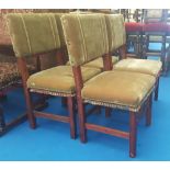 A SET OF FOUR OAK DINING CHAIRS with pierced and carved front stringer, carved front legs and