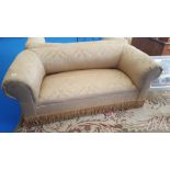 AN EARLY 20TH CENTURY TWO SEATER SOFA with roll top arms and back upholstered in gold fabric,