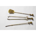 A GOOD EARLY 20TH CENTURY BRASS FIRE COMPANION SET with claw and ball tops.