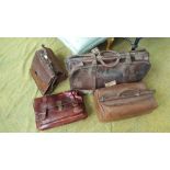 A GROUP OF FIVE LEATHER TRAVELLING BAGS.