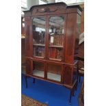 AN EARLY 20TH MAHOGANY DISPLAY CABINET with glazed upper and lower section.