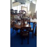 A SET OF FIVE 20TH CENTURY MAHOGANY BALLOON BACK CHAIRS with reeded front supports and upholstered