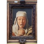 A LARGE COLOURED PORTRAIT PRINT of a woman praying, in a medieval style oak frame. 17.25" x 22.25".