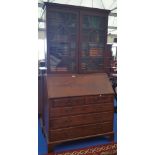 A GEORGIAN MAHOGANY BUREAU BOOKCASE with fitted interior and glazed astragal doors.