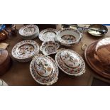 A QUANTITY OF IRONSTONE DINNER WARES in the Imari pattern. (Sir Malcolm's Kitchen).