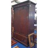 A 19TH CENTURY MAHOGANY TWO DOOR WARDROBE with drawered base.