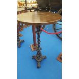 A BAR HIGH TABLE on cast iron decorative tripod base.