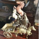 TWO SILVER PLATED REARING HORSES, along with a brass horse, trap and cannon.