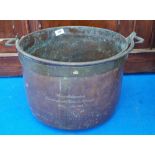 A LARGE 19TH CENTURY COPPER CAULDRON with brass rim. (Sir Malcolm's Kitchen).