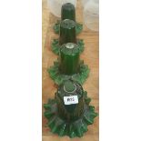 A SET OF FOUR GREEN GLASS SHADES with flared rims.
