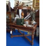 AN EARLY 20TH CENTURY OAK LIBRARY TABLE with a central frieze drawer standing on turned supports