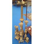 A GOOD GROUP OF BRASS PRICKET STYLE CANDLESTICKS and a good brass lamp base.