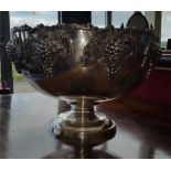 A LARGE SILVER-PLATE GRAPE & VINE PUNCH BOWL.