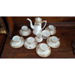 A NORITAKE GILT DECORATED COFFEE SET FOR SIX.