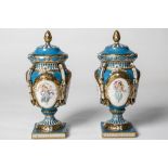 A FABULOUS PAIR OF LIDDED URN SHAPED VASES IN THE STYLE OF SEVRES decorated with panels containing