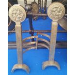 A GOOD PAIR OF BRASS FIRE SIDE ANDIRONS with decorative cut brass rosette roundels.