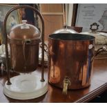 A COPPER TEA URN (lacking lid), along with another with fitted interior on a ceramic base (2).