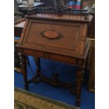 A 19TH CENTURY CONTINENTAL WALNUT BUREAU with stretcher base and gallery top.