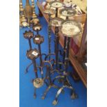 A LARGE QUANTITY OF CAST IRON PRICKET STYLE CANDLESTICKS.