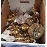 A GOOD BOX OF BRASS WICK HOLDERS AND WICKS.