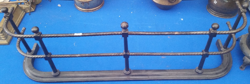 A GOOD QUALITY 19TH CENTURY STEEL FENDER with rounded corners and ball tops.