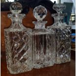 THREE GLASS AND CRYSTAL DECANTERS.