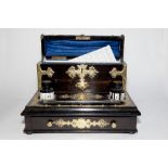 A SUPERB COROMANDEL DESK TOP WRITING BOX with single drawer, Gothic shaped top and brass mounts.