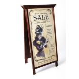 A 'GREAT CLEARANCE SALE FOR ONE WEEK ONLY' SANDWICH BOARD.