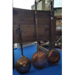 A GROUP OF THREE 19TH CENTURY COPPER WARMING PANS. (Sir Malcolm's Kitchen).