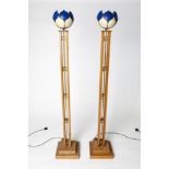 A MAGNIFICENT PAIR OF ART DECO STYLE STANDARD LAMPS with tulip style leaded glass shades.