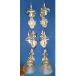 A SET OF SIX BRASS SINGLE BRANCH WALL LIGHTS silvered, lacking shades.