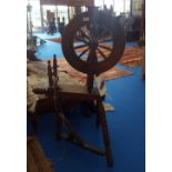 A 20TH CENTURY SPINNING WHEEL.