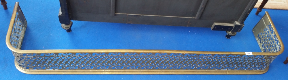 A GOOD 19TH CENTURY PIERCED BRASS FENDER.