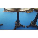 A SMALL CIRCULAR BAR TABLE with heavy decoration and cast iron tripod base. (Used in Limehouse