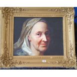 A.T.O. A COLOURED PORTRAIT PRINT of an elderly lady in a highly ornate frame. 33" x 28".