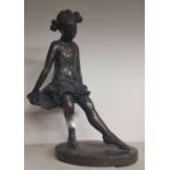 A Bronzed Figure of a Young Girl.