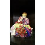 A Royal Doulton Figure 'The Flower Sellers Children'; with a receipt from the 1930's.