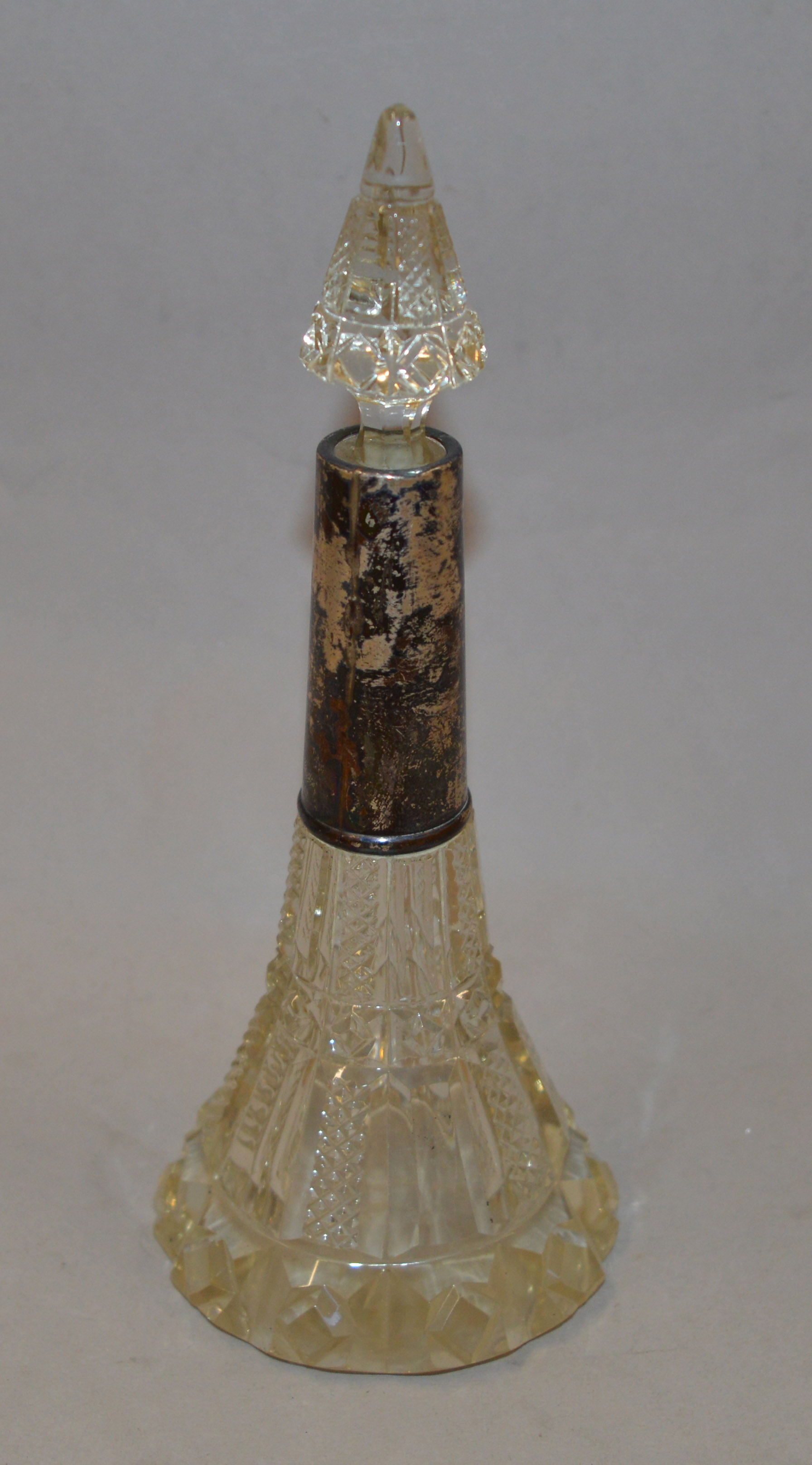 Hallmarked silver mounted hobnail cut glass scent bottle. 9cm tall.