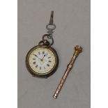 A white metal fob watch marked '0.
