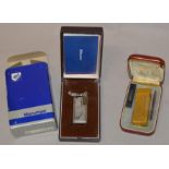 A vintage Dunhill lighter together with an unusual Maruman example,