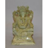 Soapstone figurine of Indian/ Asian Elephant four armed God. Height 16cm.