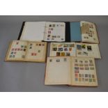 4 old stamp albums and a folder containing mostly European stamps,