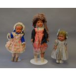 Three composition dolls, height of tallest 68 cm. Condition vary, one with head detached.