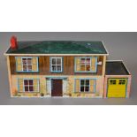 Mettoy tinplate dolls house with garage, length 59 cm, height 23 cm.