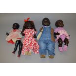 Four composition and hard plastic black dolls, height of tallest 60 cm.