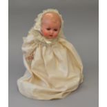 Composition baby doll, sleeping blue eyes, open mouth with teeth, moulded hair.