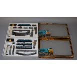 OO Gauge. Mainline. 2 x train sets. Diesel Freight & Diesel Passenger. Appear complete. VG boxed.