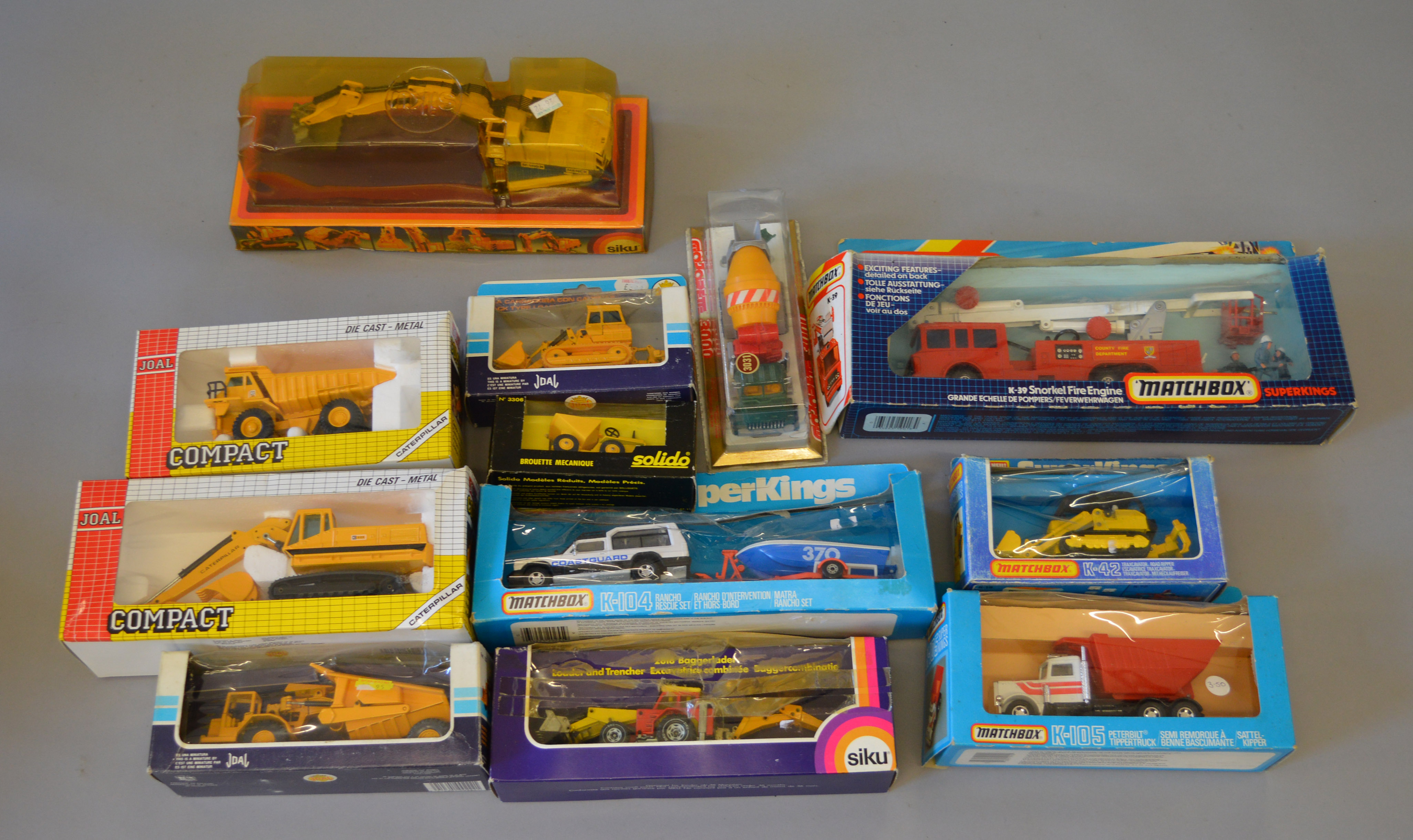 12 x diecast models constructions vehicles by Siku, Joal, Solido and Matchbox. Boxed.