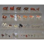 Quantity of Britains farm animals, including sitting foal and black pot bellied pig. Playworn - G.