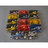 14 cased Minichamps F1 models
